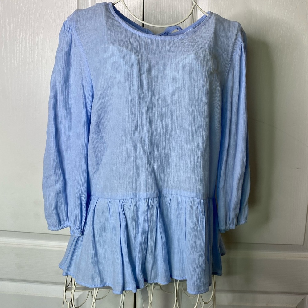 Somewhat see through but looks great with tank top under never worn